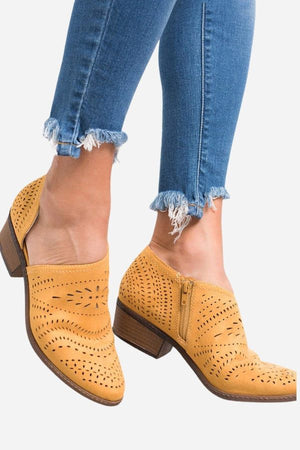 Laser cut western ankle boots in tan with low heels and side zipper