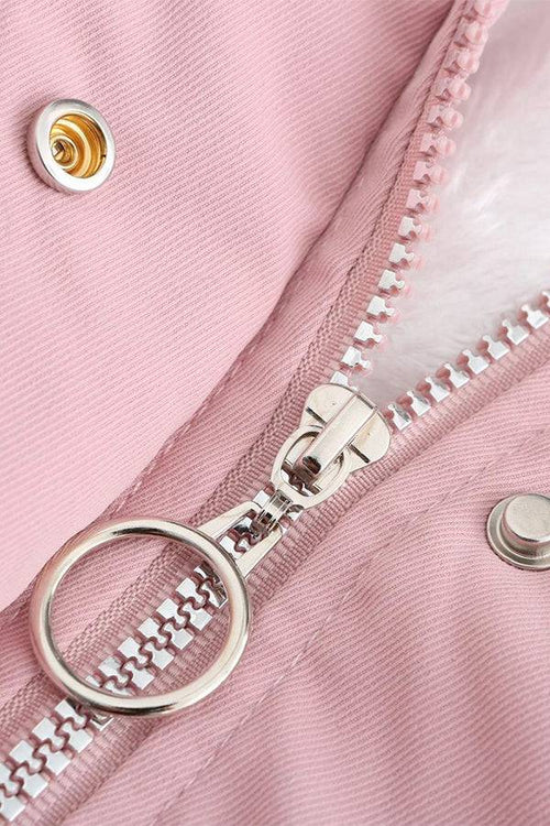 Close-up of pink thick long-sleeve zipper overcoat with silver ring zipper pull and snap button detail