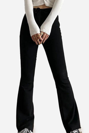 Black comfy wide-leg pants with flared design worn with white long sleeve top