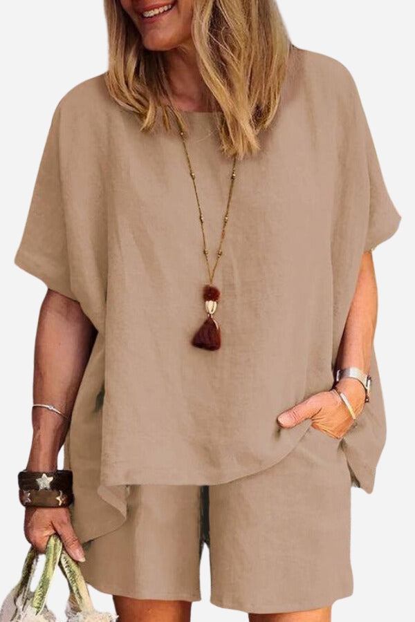 Woman wearing comfy linen-like shirt and shorts two-piece set in beige color