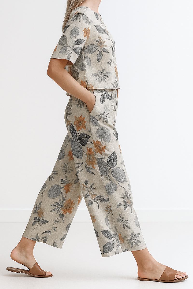 Women's loose fit co-ord set with floral print, wide-leg trousers, and short-sleeve top for relaxed comfort and style