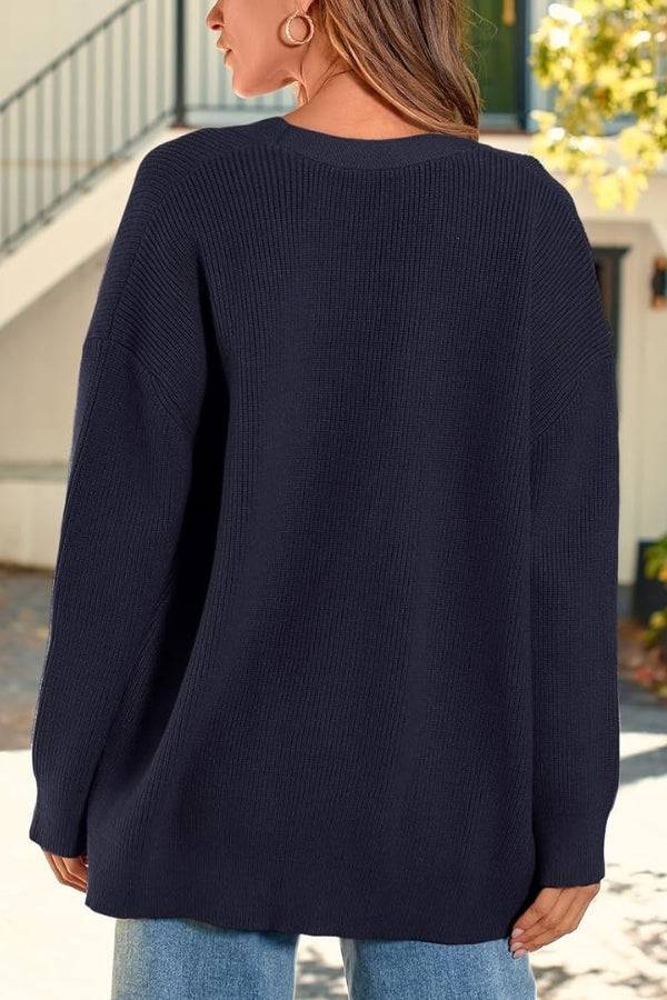 Relaxed fit oversized navy knitwear cardigan back view on model outdoors