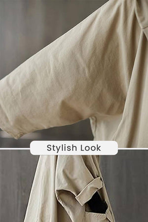 Close-up detail of beige oversized water resistant windbreaker jacket sleeve with stylish look label
