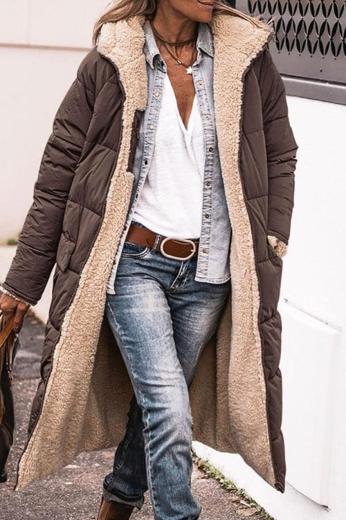 woman wearing brown sherpa-lined hooded teddy coat with denim outfit outdoors