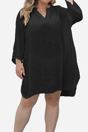 Black airy V-neck tunic with 3/4 sleeves and asymmetrical hem for a loose, breathable fit.