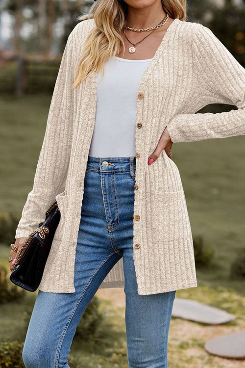 woman wearing lightweight ultra soft long knit cardigan with buttons and pockets outdoors