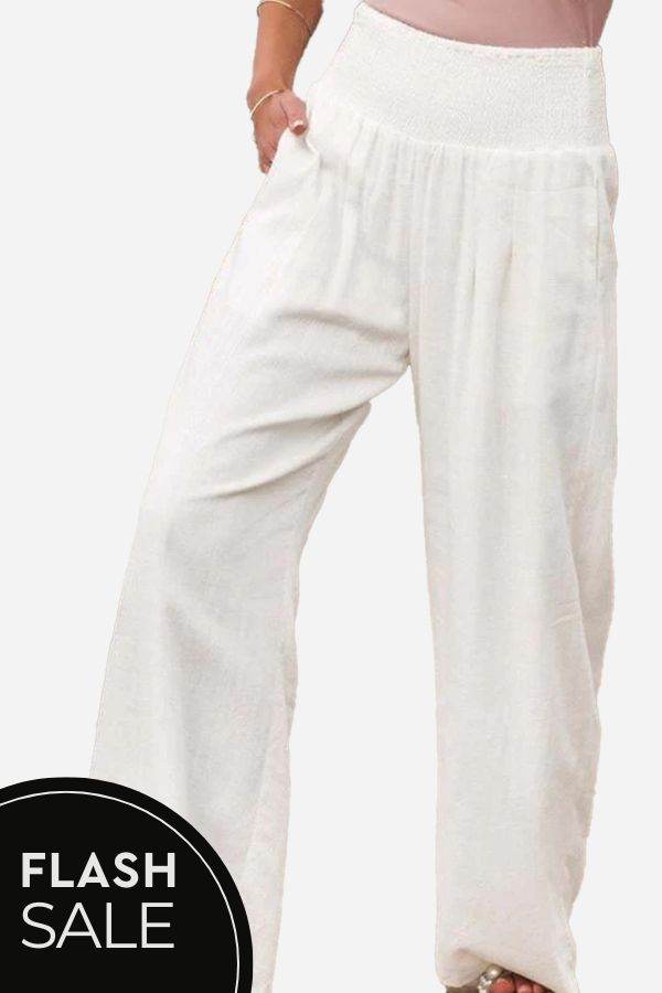 Woman wearing high-waist polyester palazzo pants with wide-leg fit and pockets