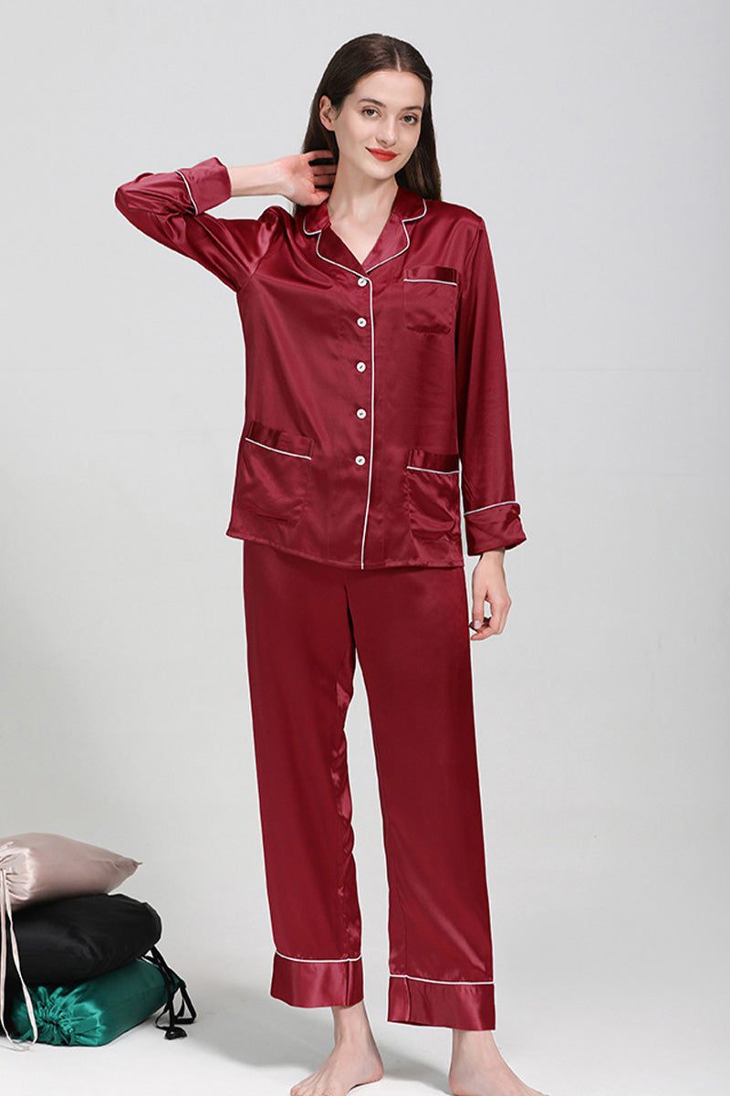 Woman wearing long sleeve silk pajamas burgundy mulberry silk button-up top and matching pants