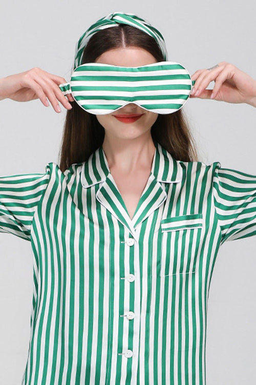 Woman wearing green and white striped mulberry silk pajama top and matching eye mask