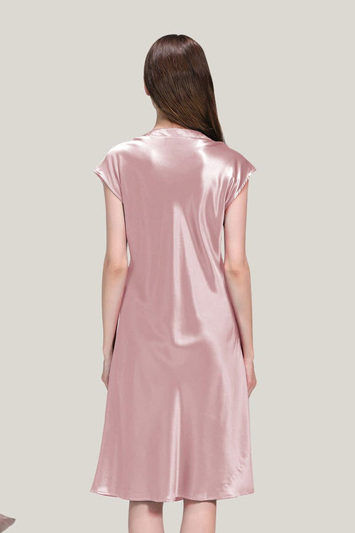 Back view of a woman wearing a pink Mulberry Silk V-Neck Nightgown showing smooth, lightweight, and flowing fabric.
