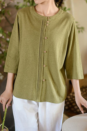 Olive green Linen Cotton Classy eco-friendly shirt with three-quarter sleeves and button front detail worn by a woman