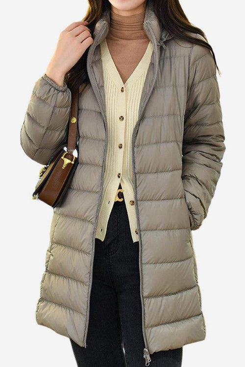 Lightweight water-resistant hooded puffer coat for women with long sleeves and a sleek design