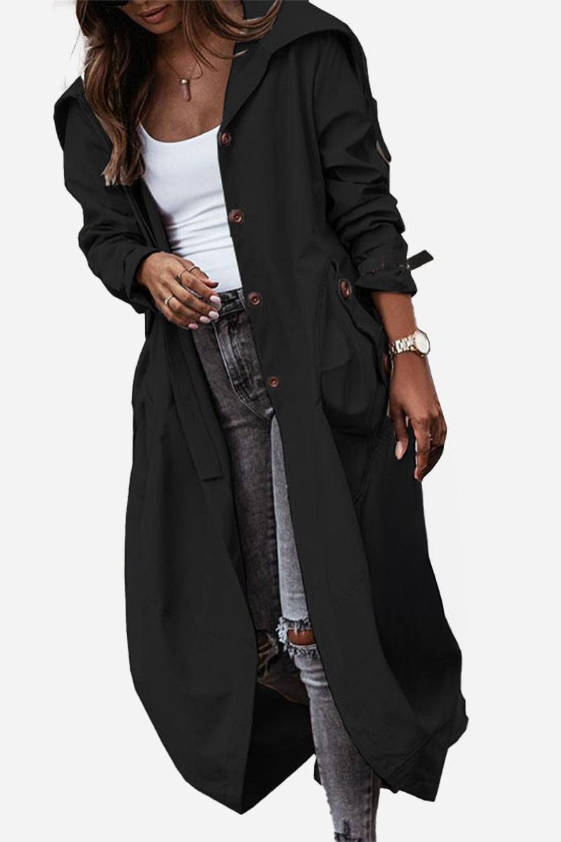 Black minimalist hooded coat with oversized fit, button front, and pockets worn over casual outfit
