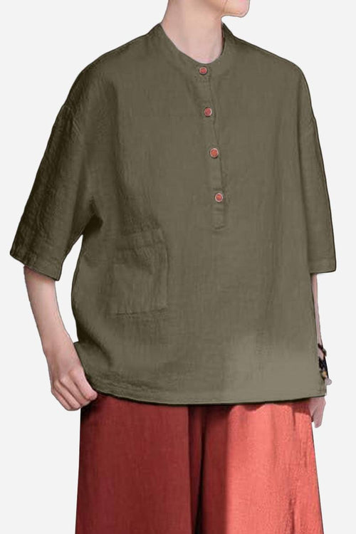 One size fits all ramie linen and cotton shirt with relaxed fit, breathable fabric, front pocket, and button details in olive green.