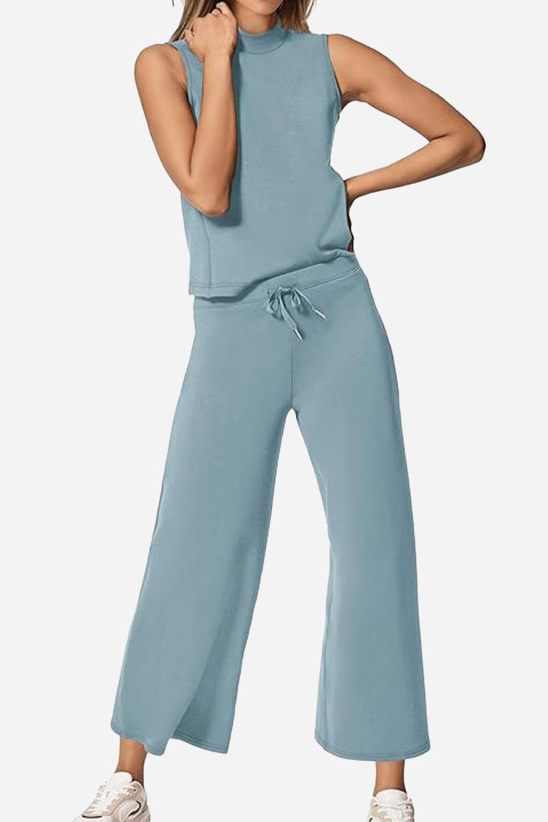 Woman wearing light blue cotton chic sleeveless two-piece set with wide-leg pants and sleeveless top