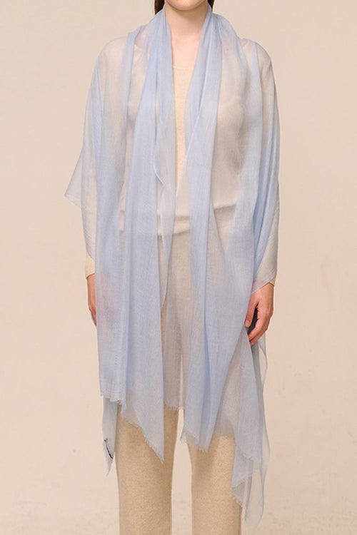 Light blue 100% cashmere featherlight luxury scarf worn over beige outfit