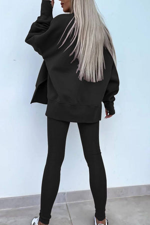 Woman wearing black TimelessChic ultra comfortable two-piece set with oversized sweatshirt and fitted leggings seen from back