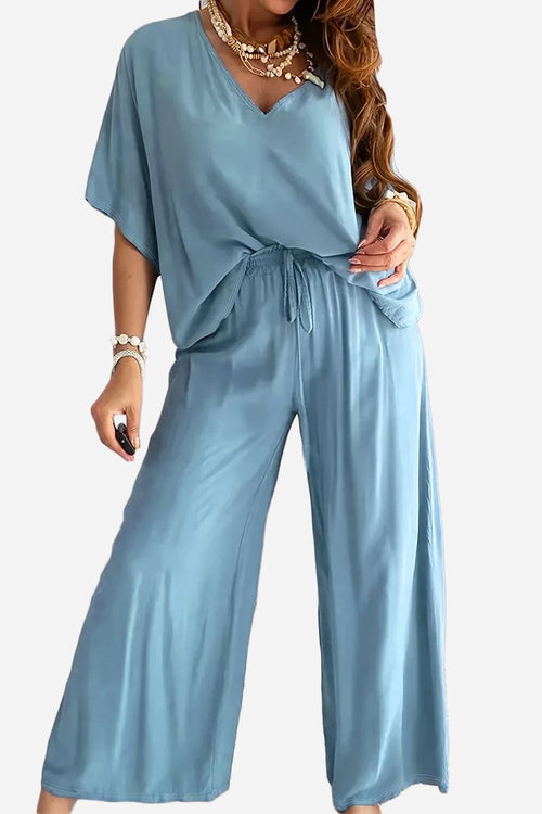 Blue two-piece pantsuit with V-neck top and wide-leg pants for women