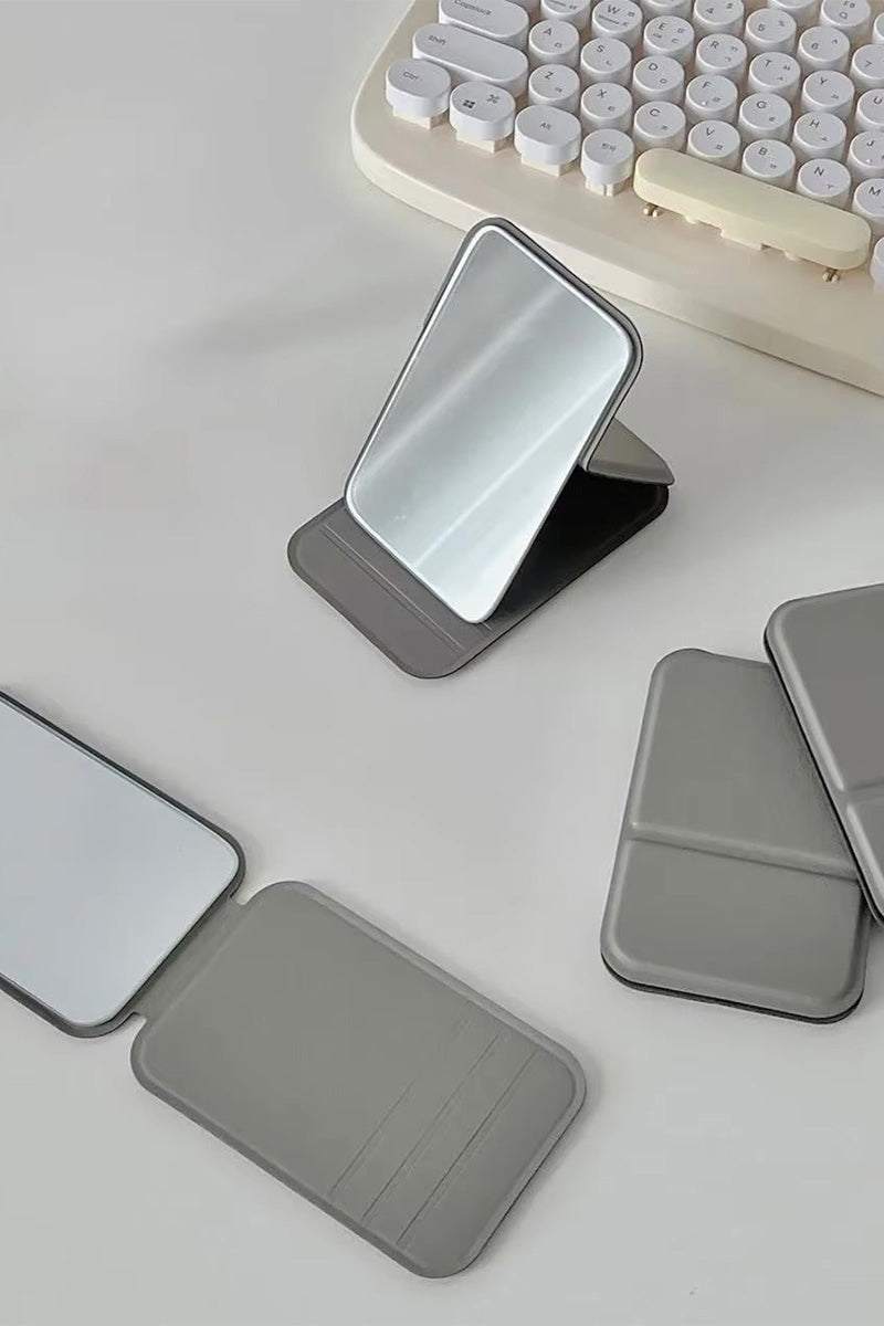 Compact travel pocket mirror with durable PU leather case in multiple colors for easy touch-ups on the go.