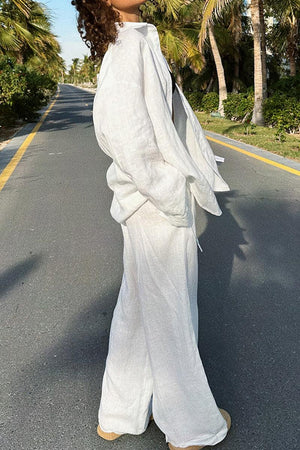 woman wearing white 100% cotton Wanderlust two-piece set walking outdoors