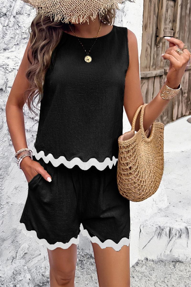 Flattering coastal scallop black two-piece set with scalloped hem, sleeveless top and shorts in lightweight viscose fabric.