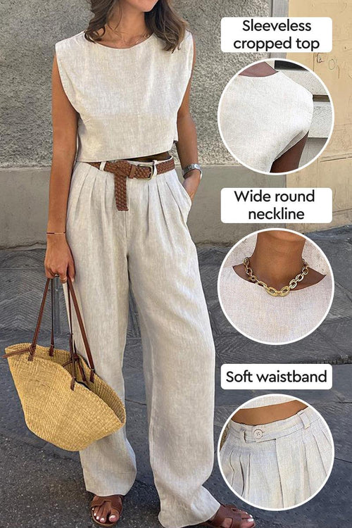 Woman wearing cotton-linen blend sleeveless cropped top and wide-leg pants with soft waistband, accessorized with brown belt and straw bag