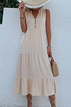 Bohemian tiered midi dress in beige with V-neck and button detail, lightweight breathable viscose fabric.