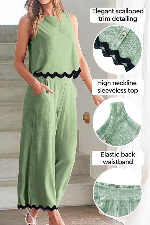 Green scalloped trim sleeveless top with high neckline and elastic back waistband paired with matching wide-leg pants