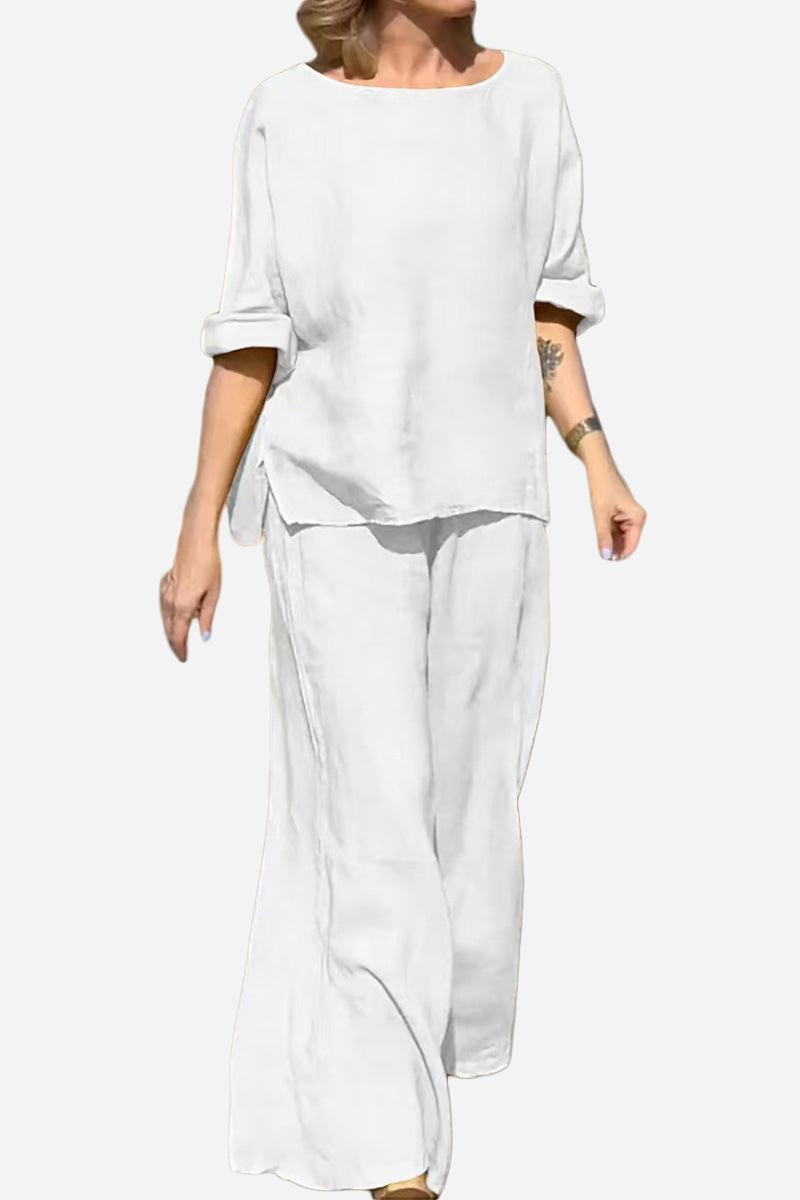 Woman wearing white 100 cotton two-piece set with round neck top and wide-leg pants