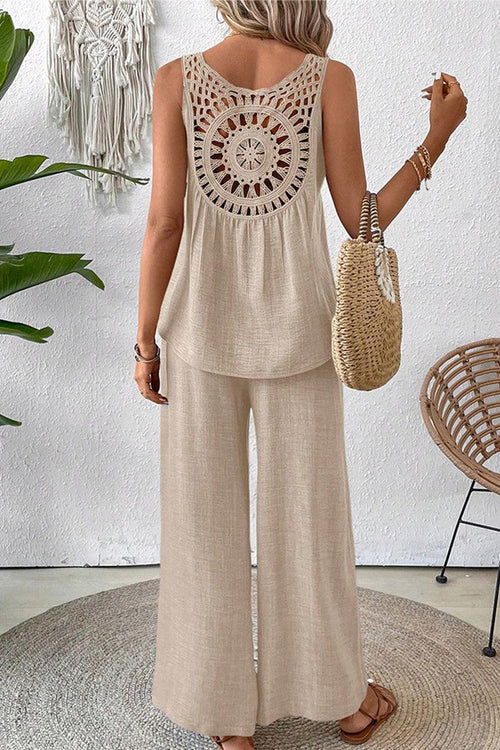 Woman wearing beige Dreamcatcher Crochet-Back sleeveless top and wide-leg palazzo pants two-piece set seen from the back.