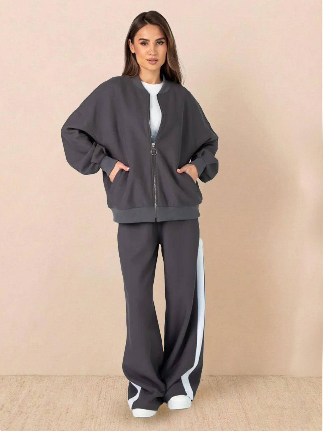 Woman wearing easy airport lounge set with zip-front jacket and wide-leg pants in soft cotton-blend fabric
