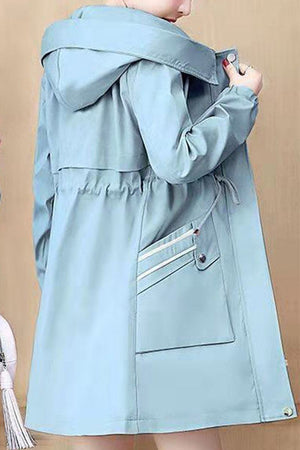 Light blue Cityscape Comfort Hooded Windbreaker jacket with plush lining and hood for cozy cold-weather wear