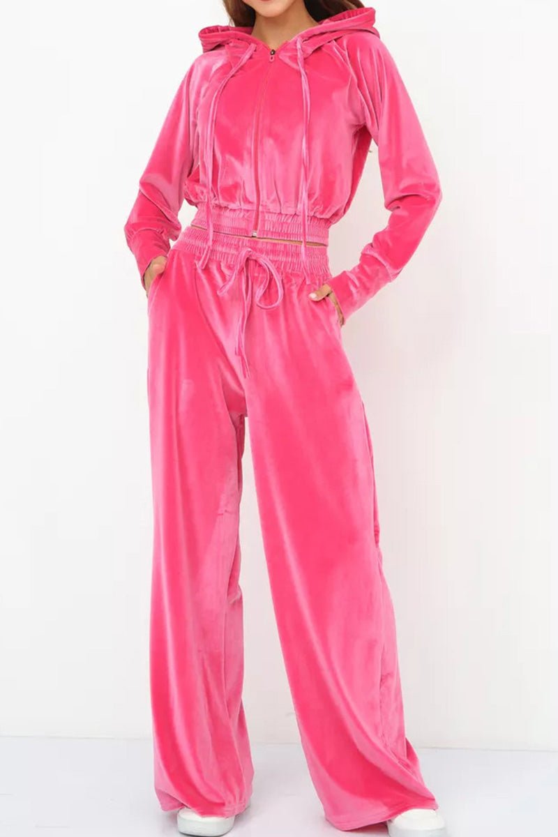 Women's bright pink velour tracksuit with cropped hoodie and high-waist pants