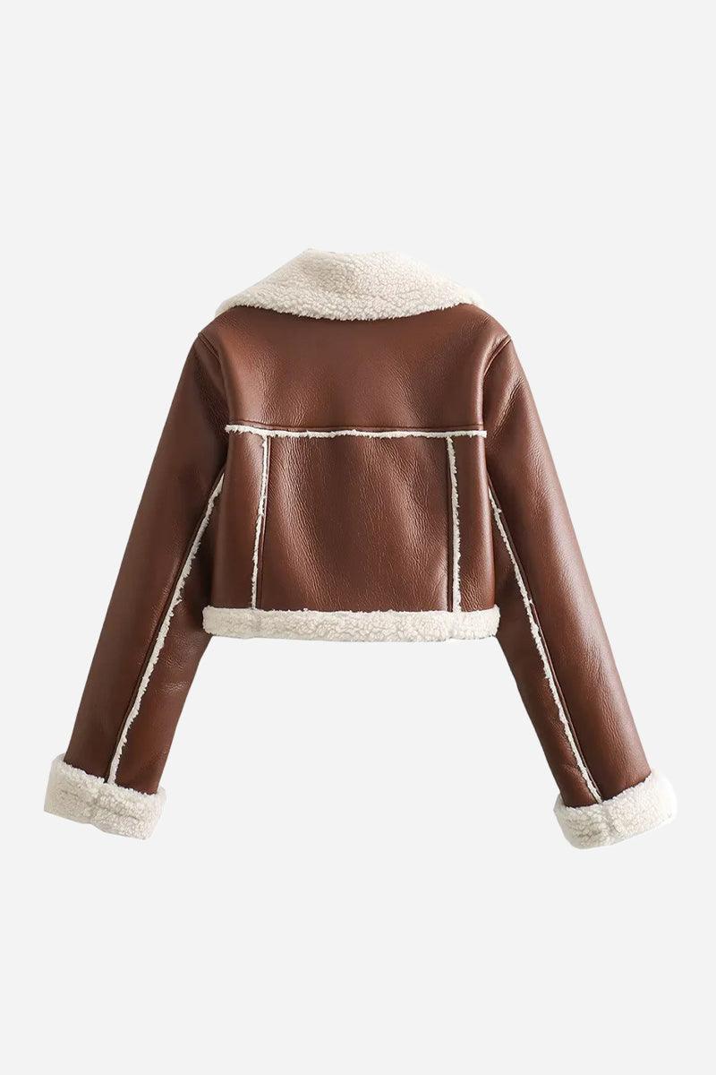 Brown cropped faux leather sherpa jacket with cream fleece lining and trim, zip front closure.
