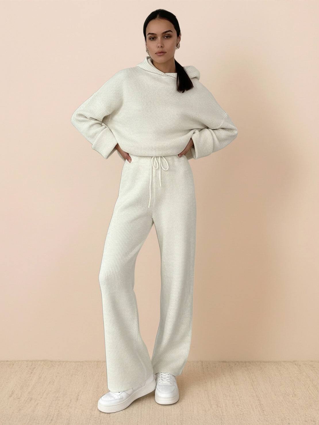 woman wearing cream waffle-knit two-piece hoodie and pants lounge set with relaxed fit