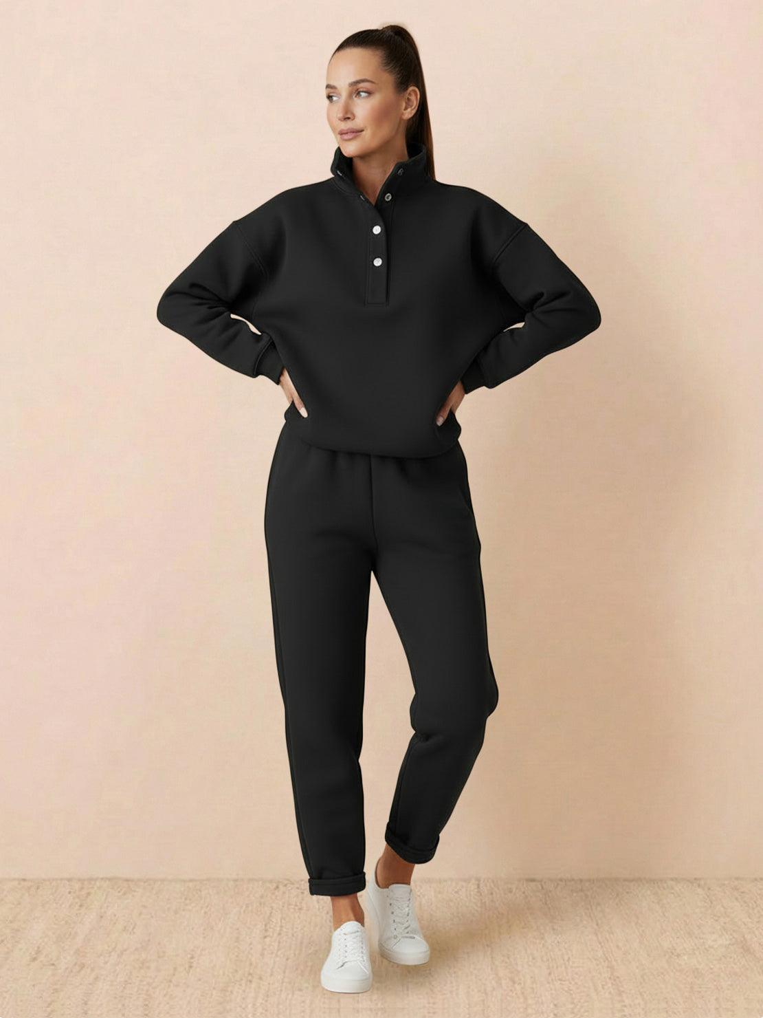 Woman wearing black Warm & Easy Two-Piece Set with pullover hoodie and matching pants.