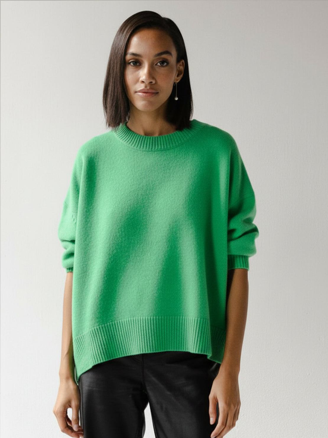 Oversized crew neck knit sweater with drop shoulder sleeves and ribbed cuffs in neutral color