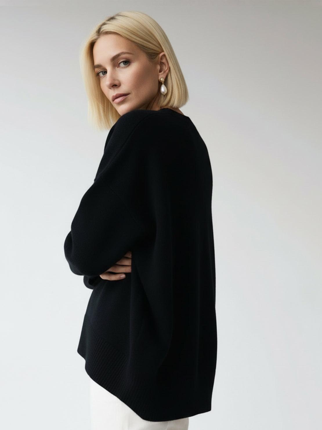 Oversized crew neck knit sweater with drop shoulders and ribbed cuffs in neutral color