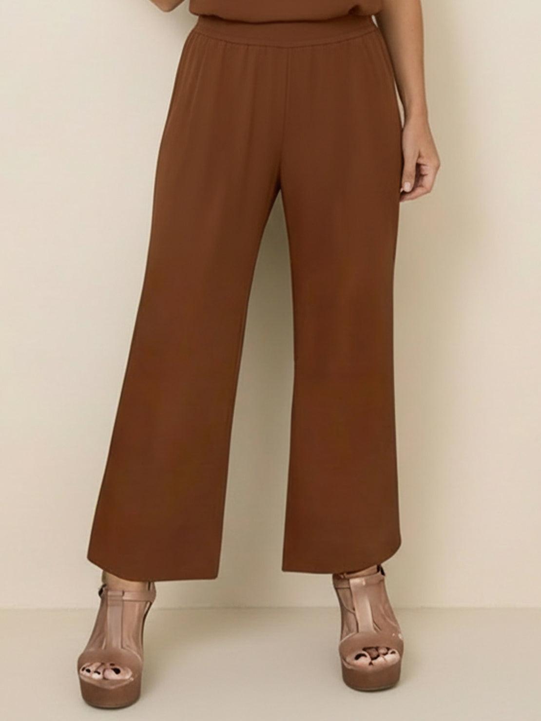 Women wearing a lightweight open-front three-piece co-ord set with longline cardigan, tank top, and wide-leg trousers