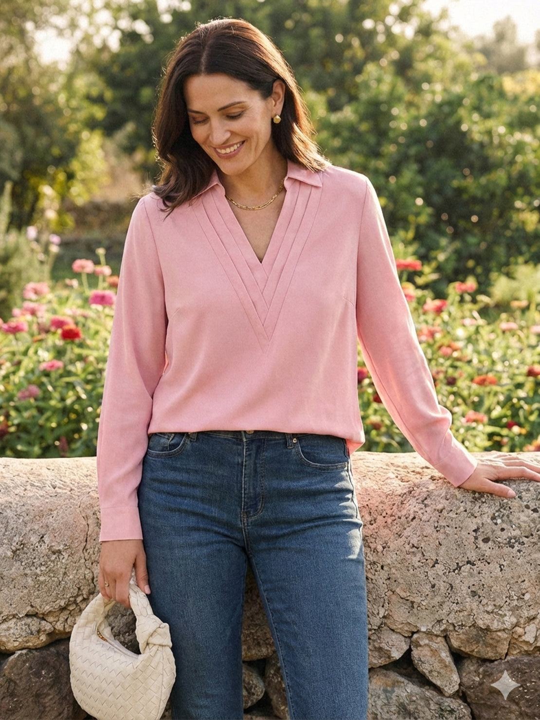 White pleated V-neck long-sleeve blouse with button cuffs and relaxed fit