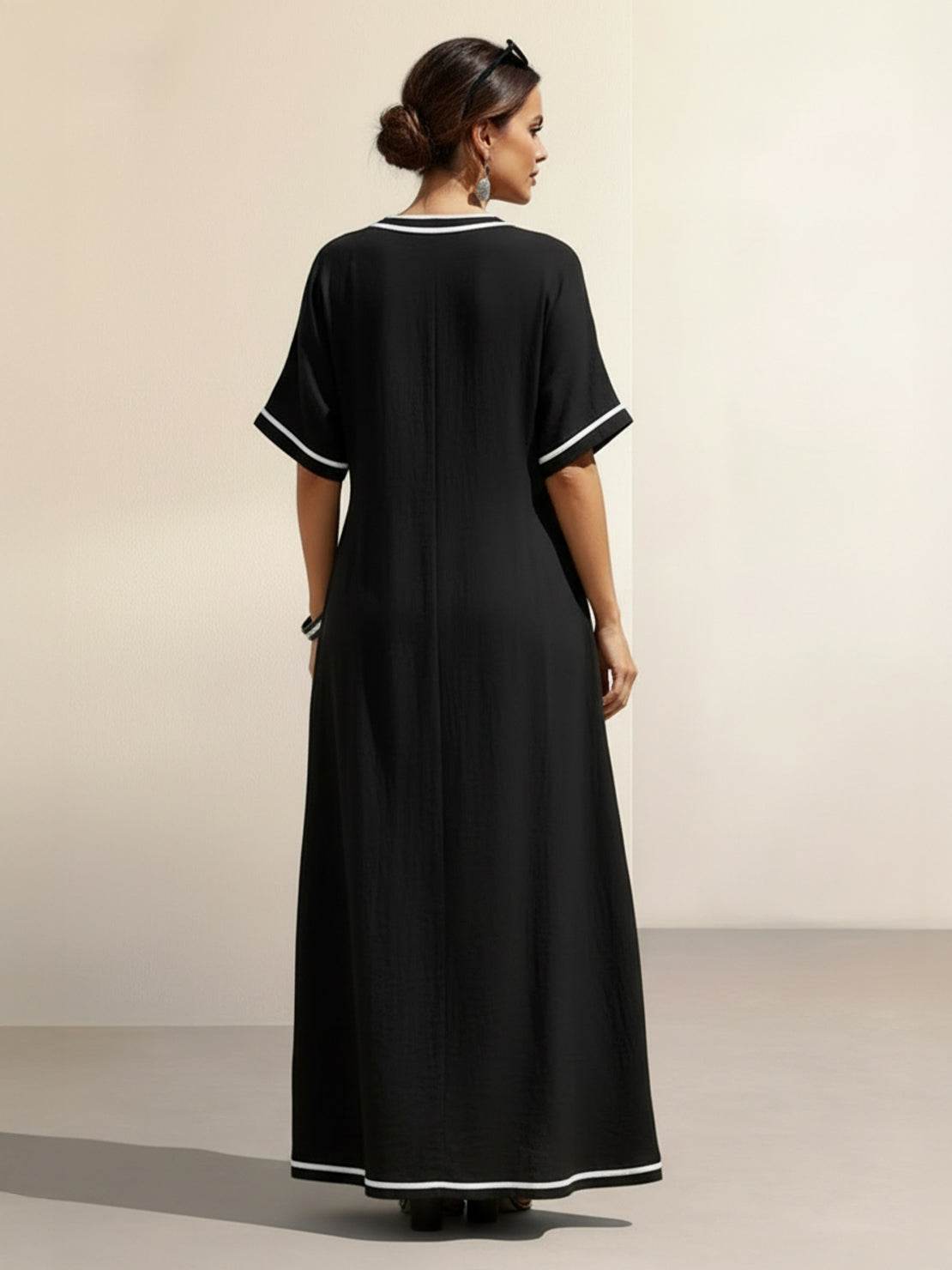 Knot-waist maxi dress with twist-knot detail, V-neckline, batwing sleeves, and flowing skirt in lightweight fabric