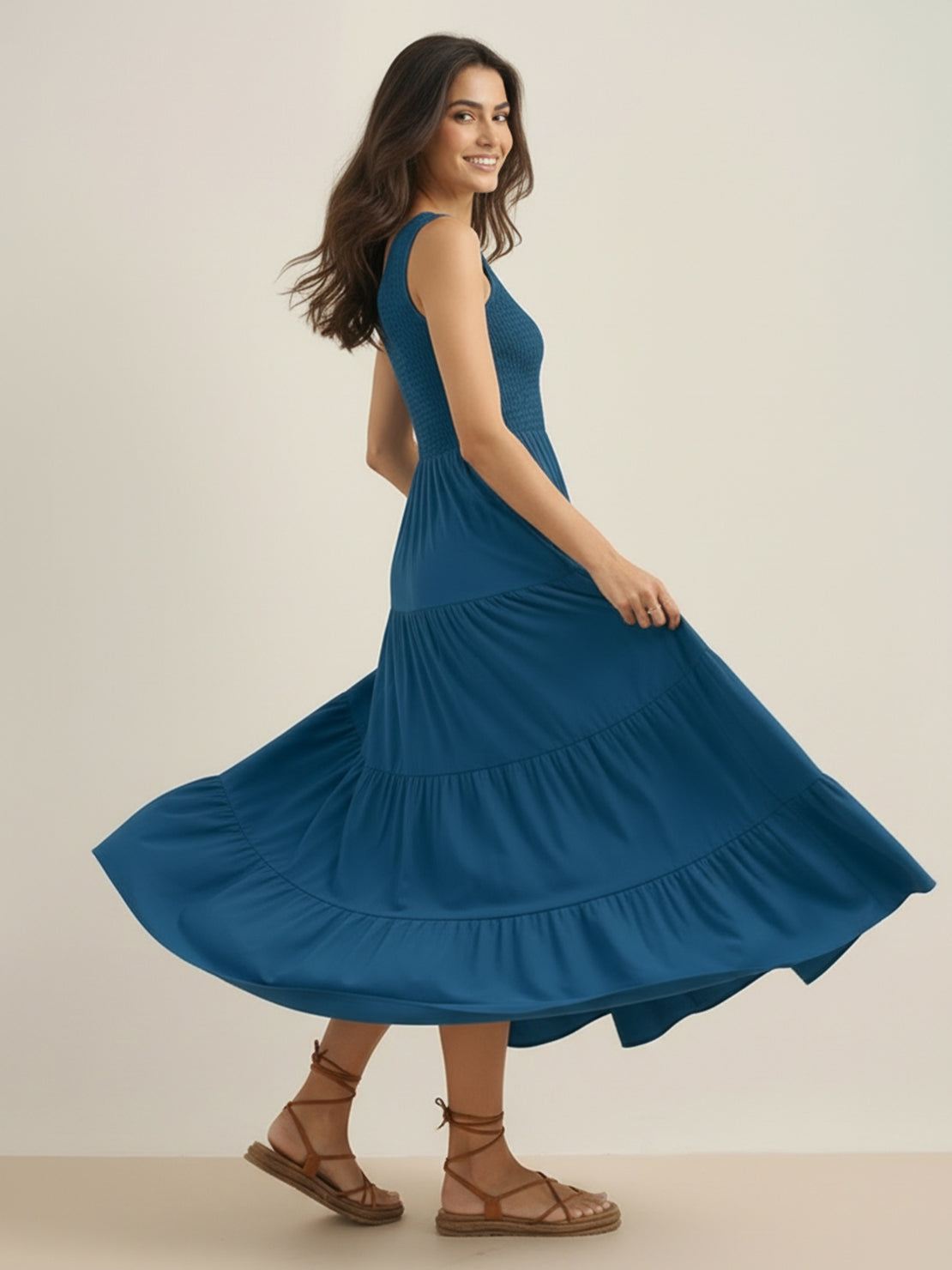 Smocked sleeveless maxi dress with tiered skirt and scoop neckline in breathable fabric