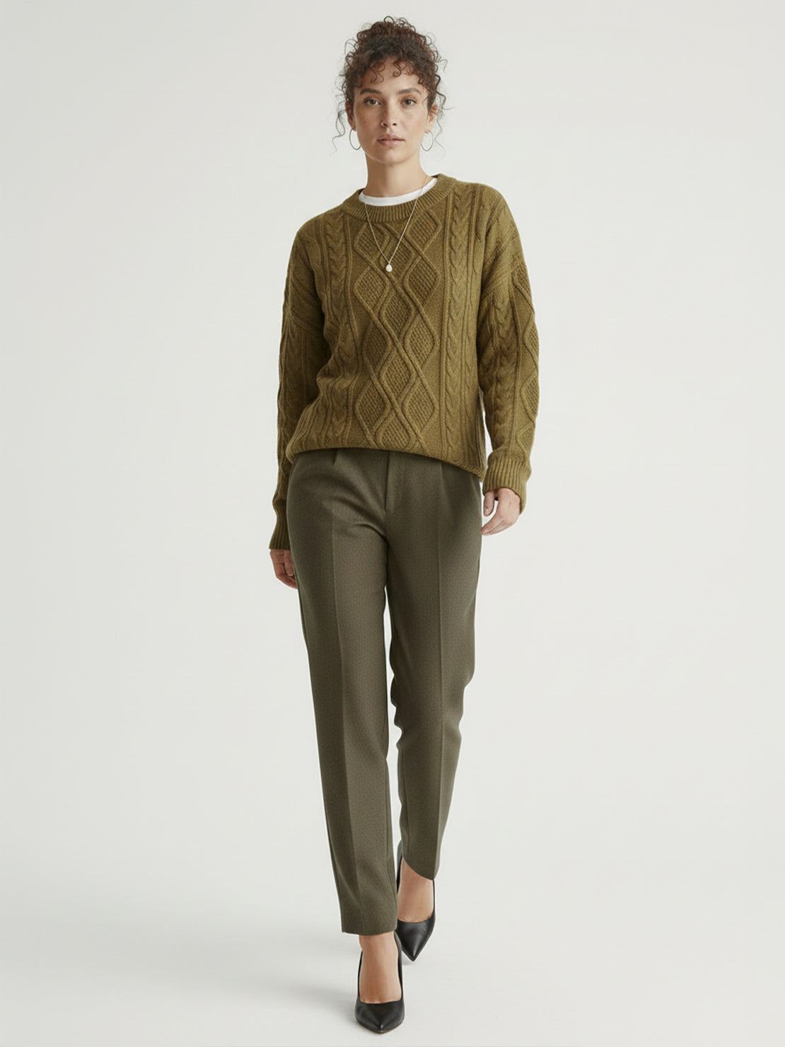 Oversized cable-knit crewneck sweater with dropped shoulders and ribbed cuffs in thick plush fabric