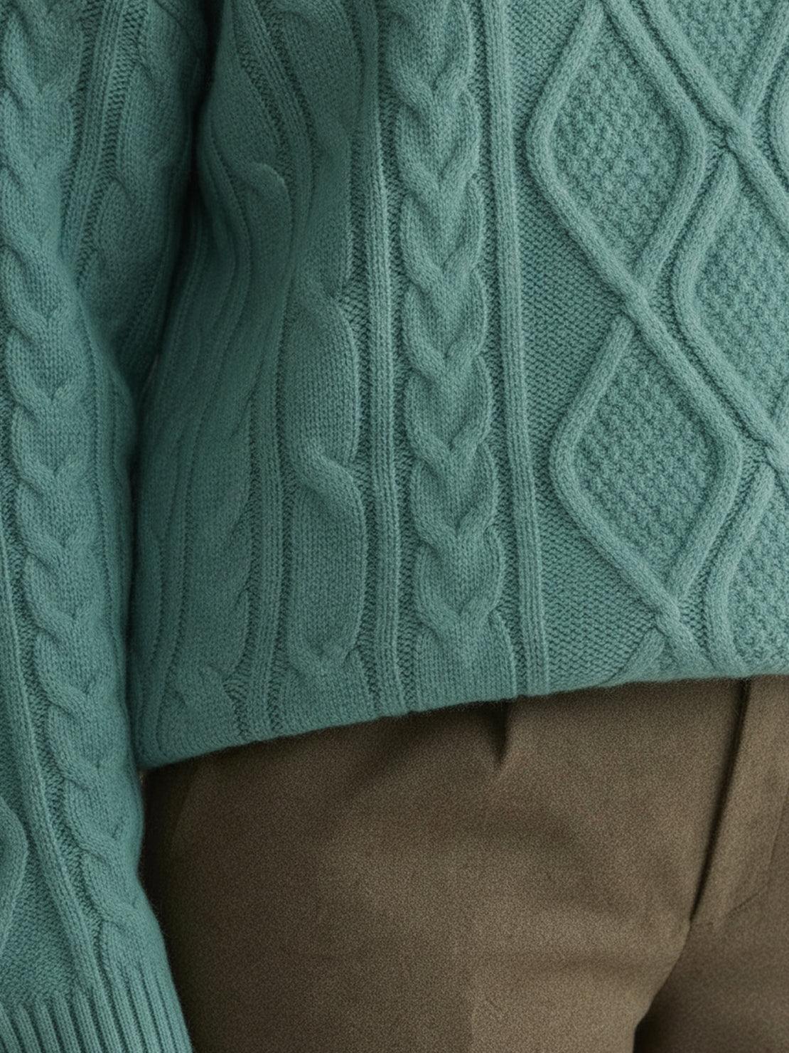 Oversized cable-knit crewneck sweater with dropped shoulders and thick plush fabric