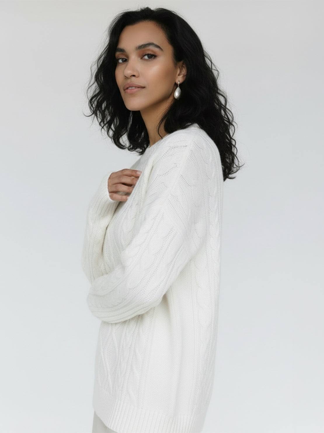 Oversized cable-knit crewneck sweater with dropped shoulders and ribbed trims in thick plush fabric