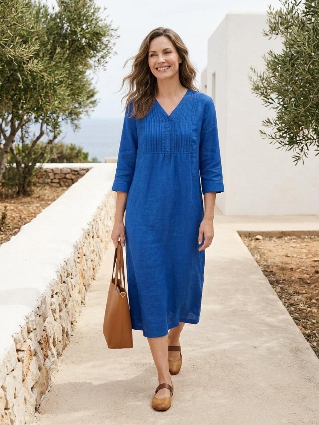 Relaxed cotton linen dress with pintuck pleats, 3/4 sleeves, side slits, and breathable fabric