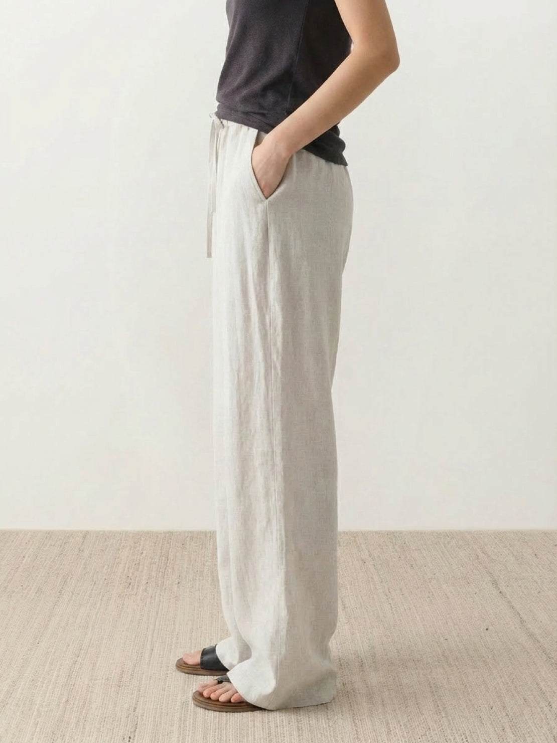 100% linen wide-leg pants with high-rise elastic waistband and side pockets
