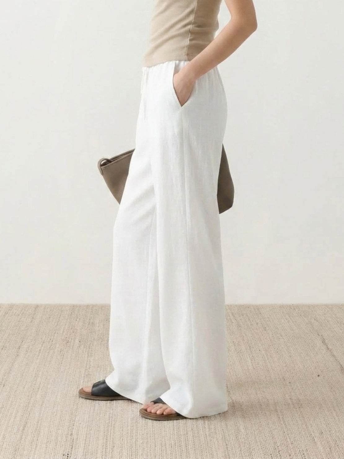 100% linen wide-leg pants with high-rise elastic waistband and side pockets