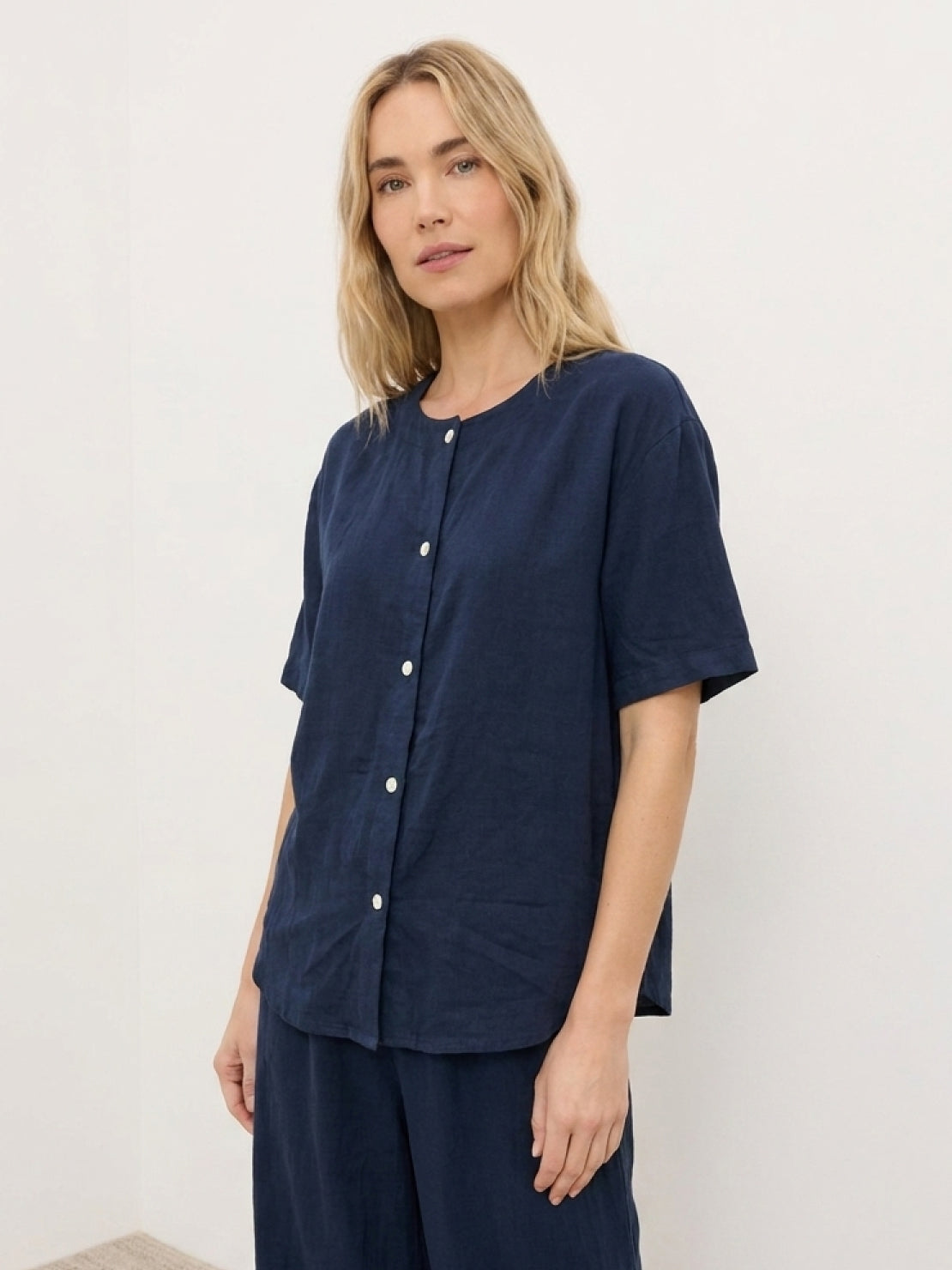 100% cotton two-piece set with button-front top and wide-leg pants in soft solid colors