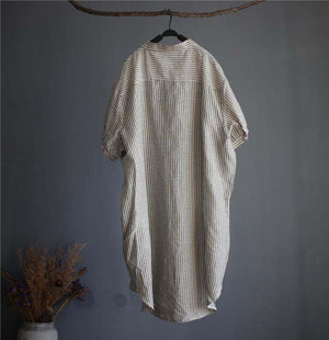 Striped linen blend gauze midi shirt dress with short sleeves and button fastening hanging on wooden hanger
